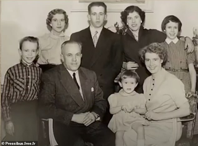 The little girl with a pudding bowl haircut sitting on her mother's knee is Brigitte Trogneux, and far left is her brother Jean-Michel