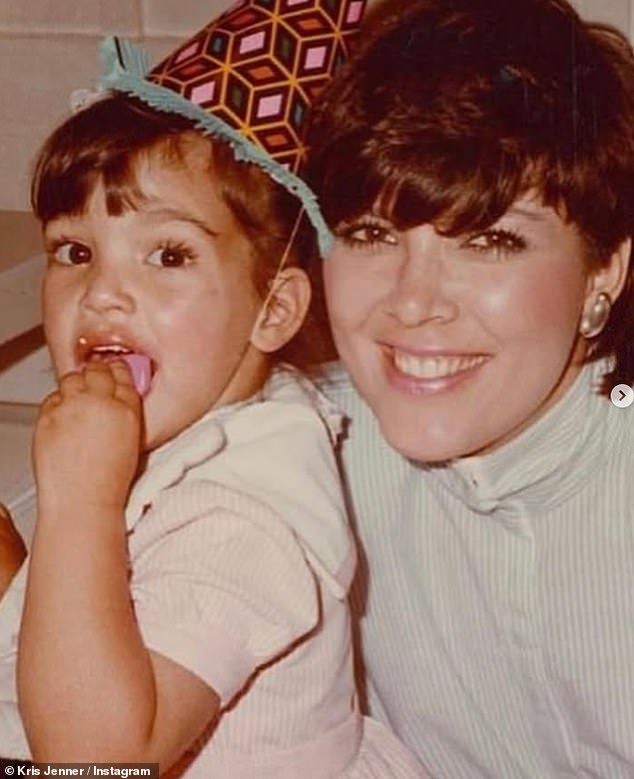 Kris pictured with Kim as a toddler