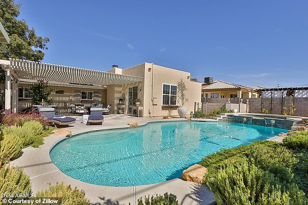 The Scholtes family upgraded their existing property to this gorgeous new home in Phoenix complete with a huge backyard swimming pool