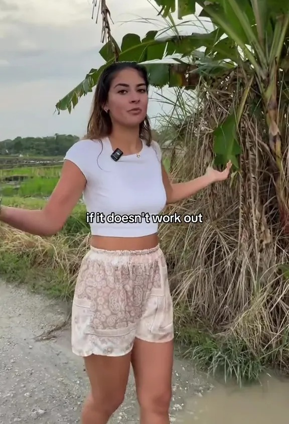 A woman standing in a field next to a banana tree, with text "if it doesn't work out" overlaid.