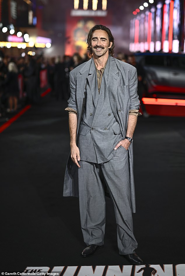 He cut a dapper appearance in a trendy oversized suit