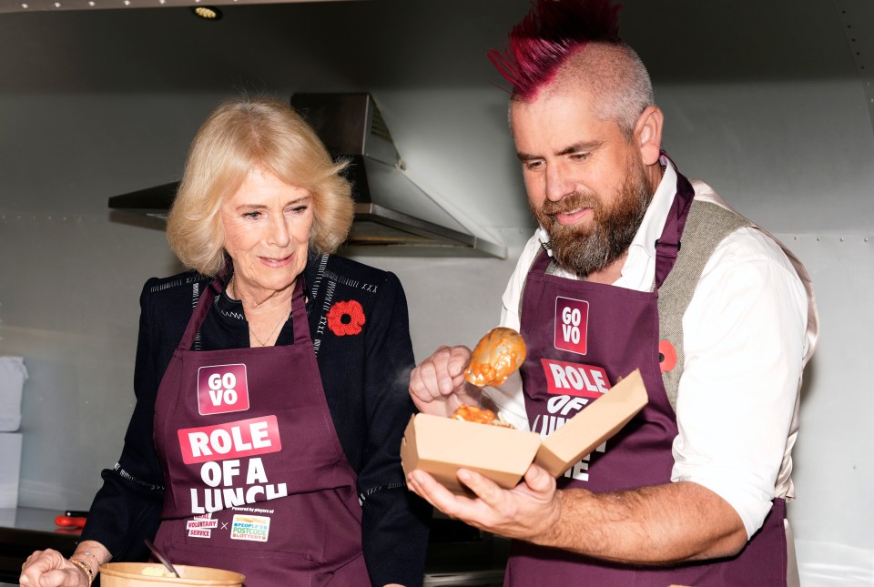 Queen Camilla helps Spudman prepare food as he delivers jacket potatoes in a Royal Voluntary Service food truck.