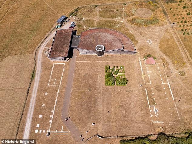 Brading Roman Villa is described as one of the finest Roman sites in the UK. Today it has a visitor centre, gift shop and café. In this bird's-eye view, the hypocaust is the small pink-roofed building to the right