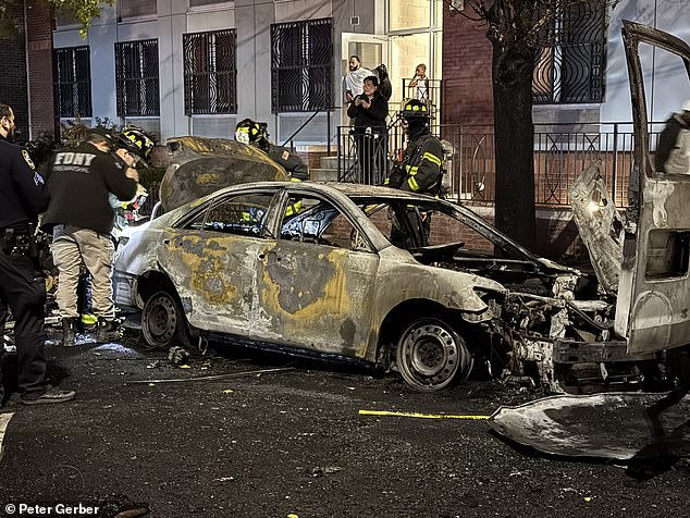 The burned out vehicle is pictured following the blaze, which was completely under control by 8.19pm