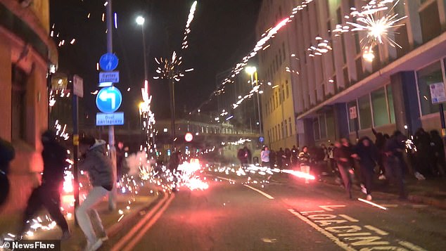 Hooded men were seen holding large roman candles and multi-shot barrages, aiming them at innocent bystanders