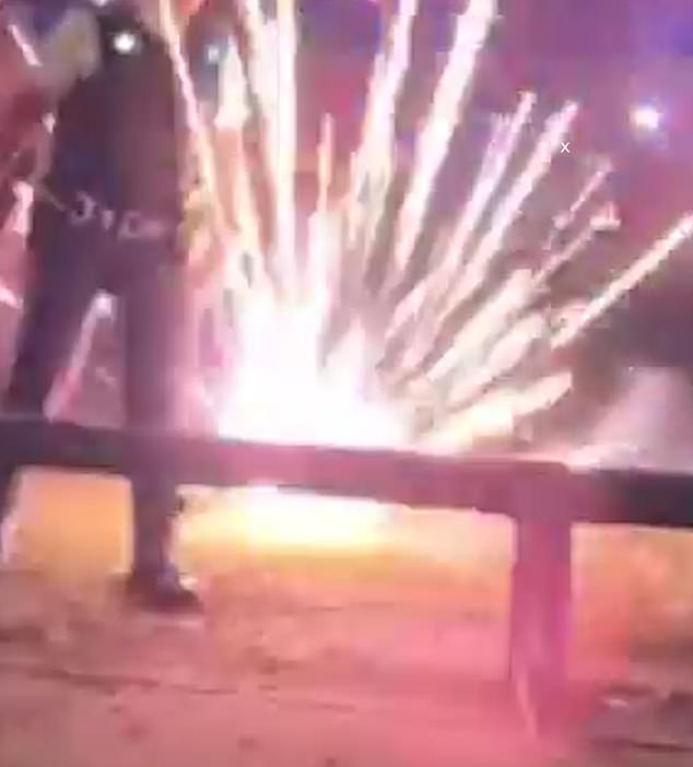 It also showed the shocking moment thugs hurled fireworks at police officers and firefighters