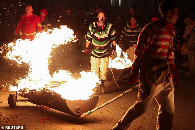 Some participants at Lewes pictured wheeled flaming barrows behind them