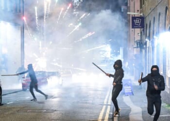 Bonfire Night descends into chaos across UK as teens arrested after cops pelted with fireworks & flares hurled at cars