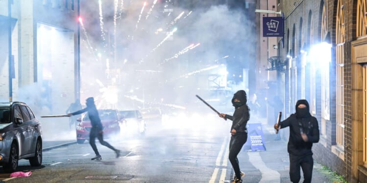 Bonfire Night descends into chaos across UK as teens arrested after cops pelted with fireworks & flares hurled at cars