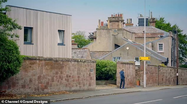 Neighbours had been worried that the new property (left) did not fit in with the surrounding period homes on the street