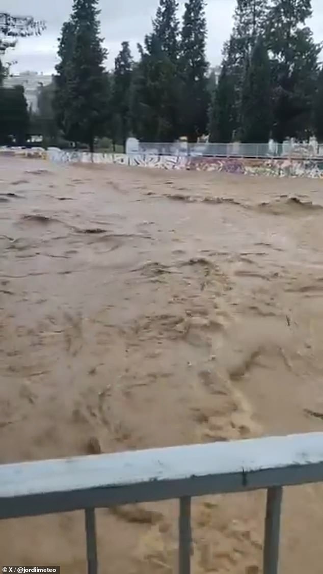River Sec in Catalonia is seen overflowing in this video grab