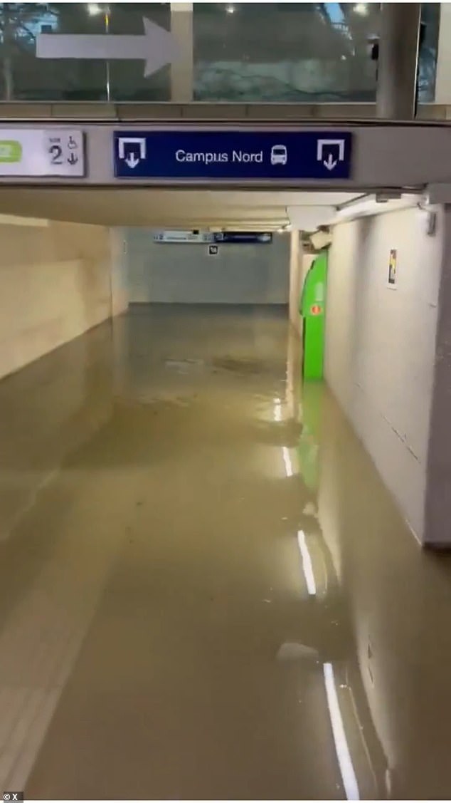 A garage is seen submerged in water in Catalonia after the region was struck by mega storm Melissa