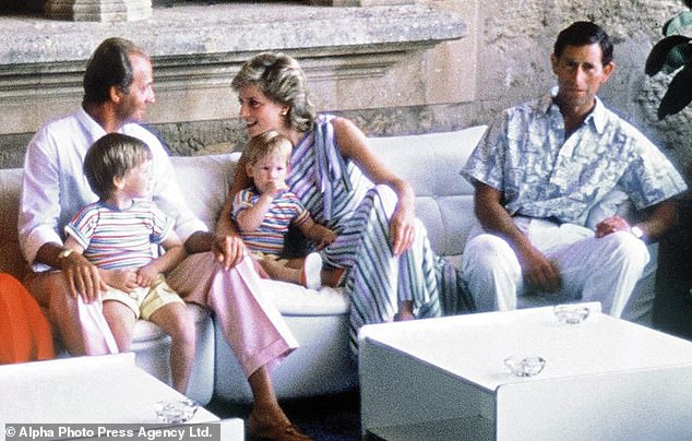 Juan Carlos was close to the British royal family. Above: Carlos with Prince William on his lap as he chats to Princess Diana during a royal visit to Majorca in 1986