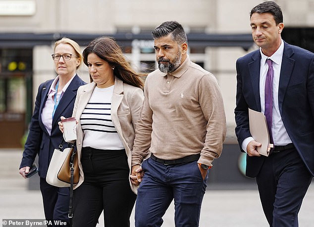 Alice da Silva Aguiar's parents Sergio and Alex (centre) arrive at Liverpool Town Hall for the Southport Inquiry
