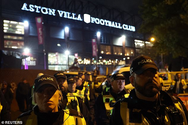 Hundreds of police officers gather outside Villa Park before forming a cordon to prevent surges