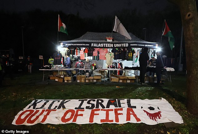 A banner laid out on a green near to Villa Park, suggesting Israel should be banned by FIFA, football's governing body