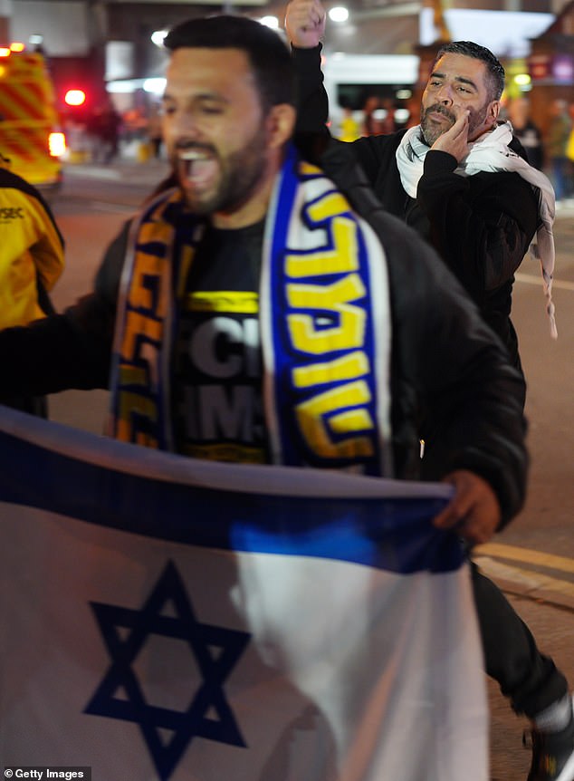 Israeli fans showing their support by waving flags on the streets. The two groups defied a police ring of steel