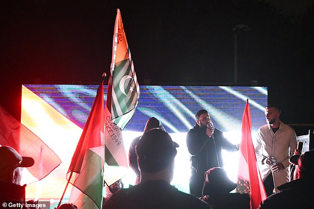 A speaker addresses a crowd of pro-Palestine demonstrators in Birmingham shortly before kick-off