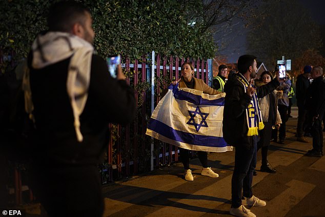 Football fans pictured with Israeli flags on the streets of Britain's second city ahead of the football match