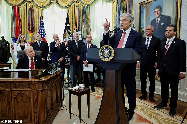 The man (fourth from left) passed out at Trump's Oval Office event on Thursday