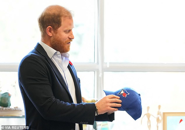 As a humorous gift, Harry was presented with a Toronto Blue Jays cap after he was spotted wearing a LA Dodgers hat during their match against the Toronto Blue Jays last week