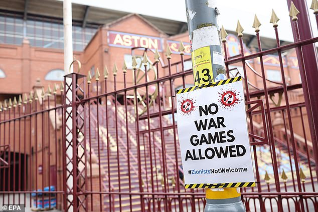 Every lamppost had been adorned with the red, green, white and black flags of Palestine. Below them were cardboard placards bearing such punchy slogans as 'No war games allowed'