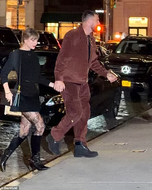 Looking smitten with her 6foot5inch boyfriend, Swift strolled beside him in a sexy black miniskirt and leather thigh-high boots