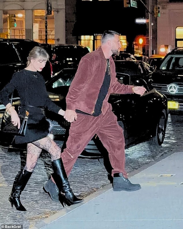 She completed her chic outfit with lace fishnet tights and a classic black long-sleeve top