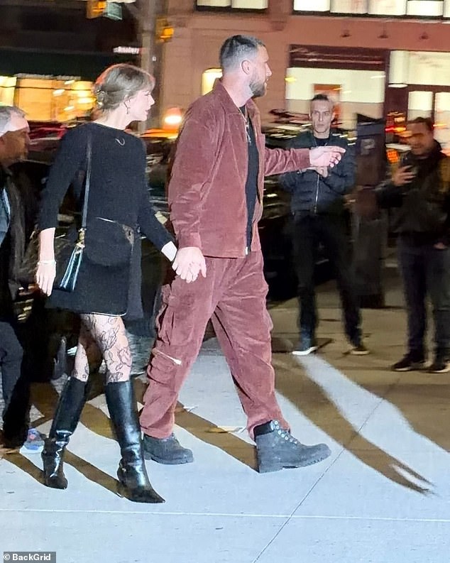 Swift's engagement ring was hidden from view as she kept her left hand locked in Kelce's during their short walk to the club's front entrance