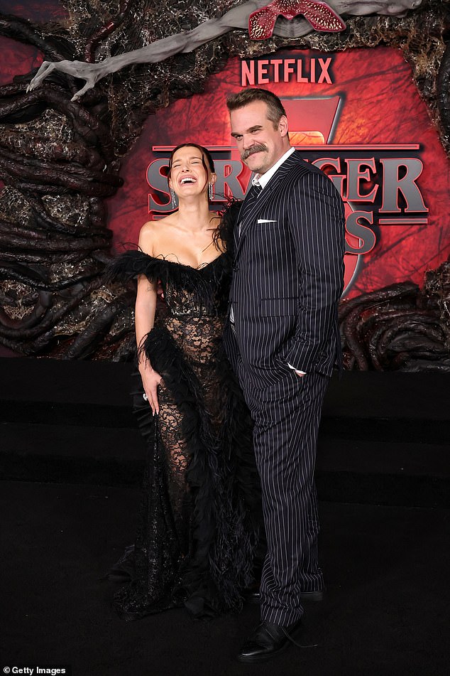 David wore a black pinstripe suit, though he gave the outfit a tacky touch with a tie in the same striped pattern as his suit