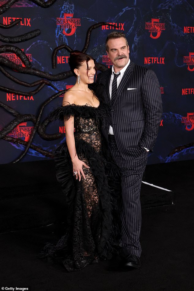 He paired the suit with black leather derbies and a white shirt, and he boasted a thick salt-and-pepper walrus mustache