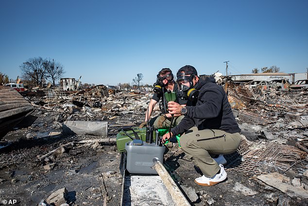 Members of the Kentucky National Guard's Civil Support Tam are pictured testing the debris