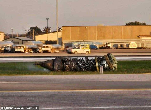 What appears to be a plane engine is seen here lying on the runway following the crash