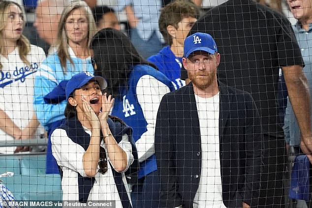 Prince Harry (right) and Meghan Markle (left) watch in the seventh inning between the Toronto Blue Jays and the Los Angeles Dodgers during game four of the 2025 MLB World Series at Dodger Stadium
