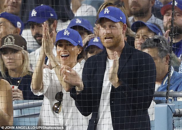 Prince Harry and Meghan Markle attend the fourth game of the MLB World Series between the Los Angeles Dodgers and the Toronto Blue Jays