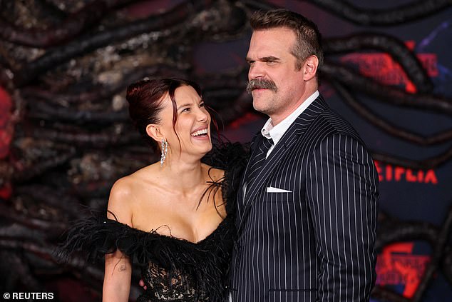 The two had their arms around each other affectionately as they posed for the cameras, and both flashed wide smiles