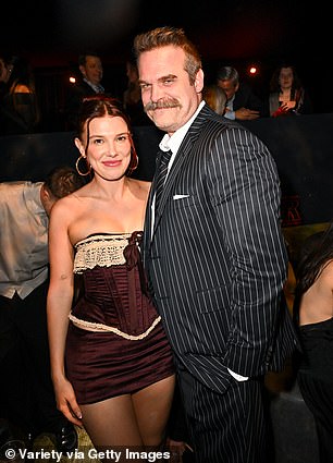 Millie put on a stunning display in a busty black lace off-the-shoulder gown