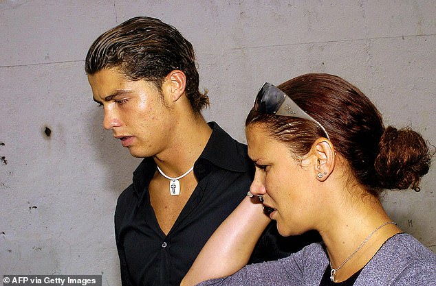 The Portuguese star with his sister Elma at the funeral of their father Jose Dinis Aveiro