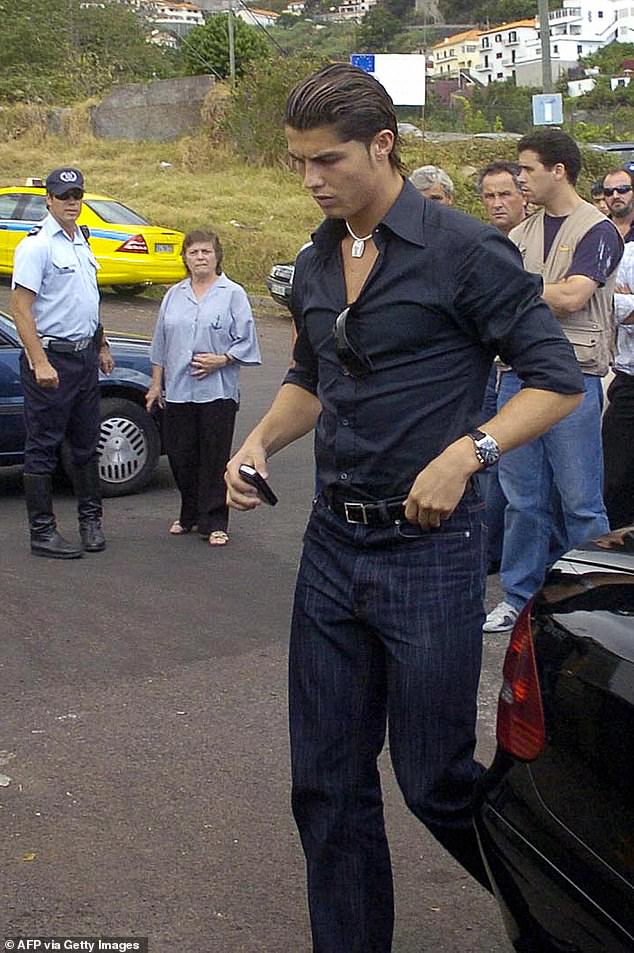 Ronaldo cuts a downcast figure as he arrives for his father's funeral in Funchal, with police watching on