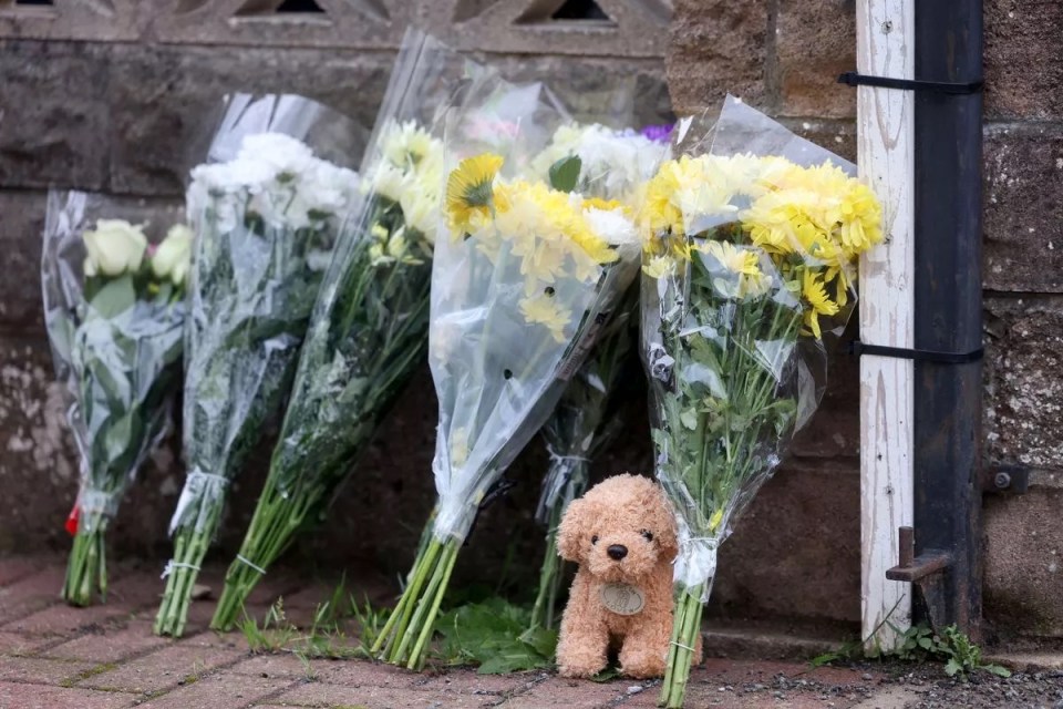 Floral tributes and a teddy bear placed outside a home in Rogiet following the death of a baby.
