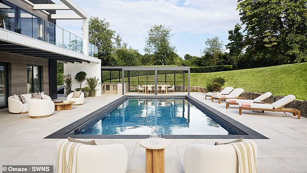 Mr Walker was delighted that his daughters 'can even learn to swim in their very own pool!'