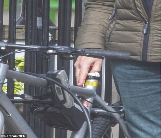 Undercover surveillance captured the moment Phillips posted the package into the seat of the bicycle