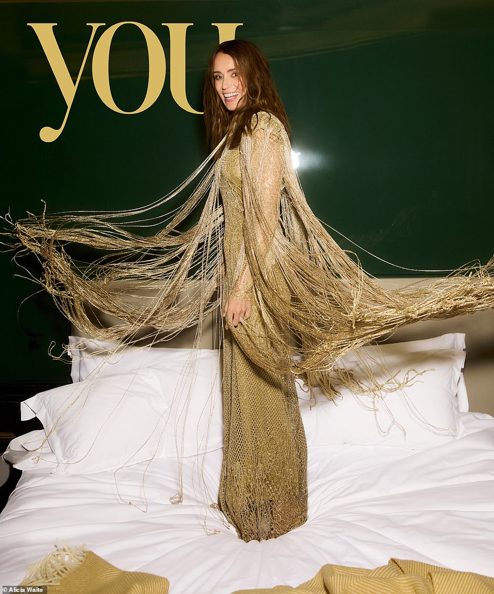 Keeley wears a metallic knit cape, metallic arabesque lace knit and matching slip dress, all Dior. She's shooting this cover story for YOU's luxury issue and is ostensibly here to talk about fashion and luxey things like sitting opposite Dua Lipa at the Met Gala