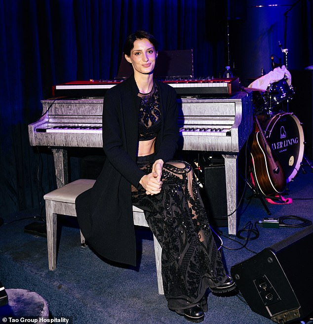 Audrey dressed for the occasion donning a sheer black cropped top with sparkling embellishments as well as matching trousers