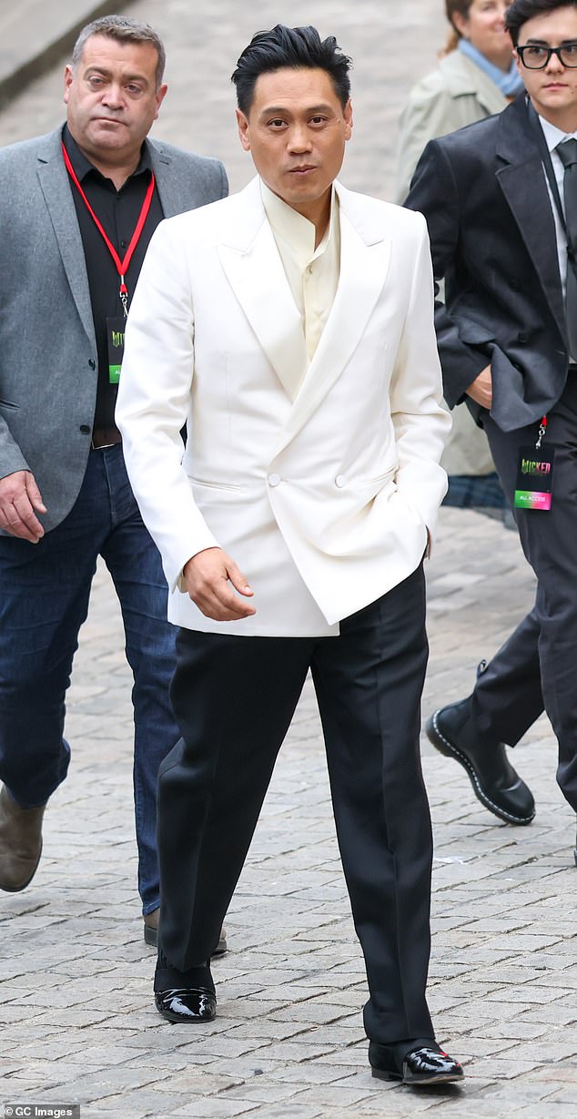 The movie's director Jon M Chu (centre) joined his cast