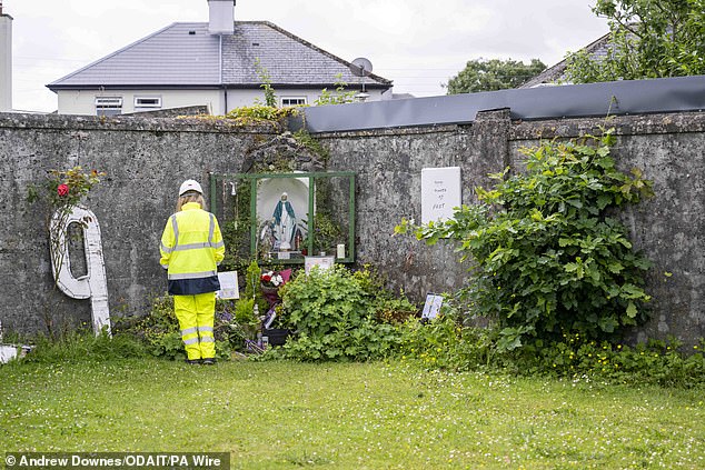 An excavator at the site - the excavation process is part of efforts to try to identify the remains of infants who died at the home between 1925 and 196