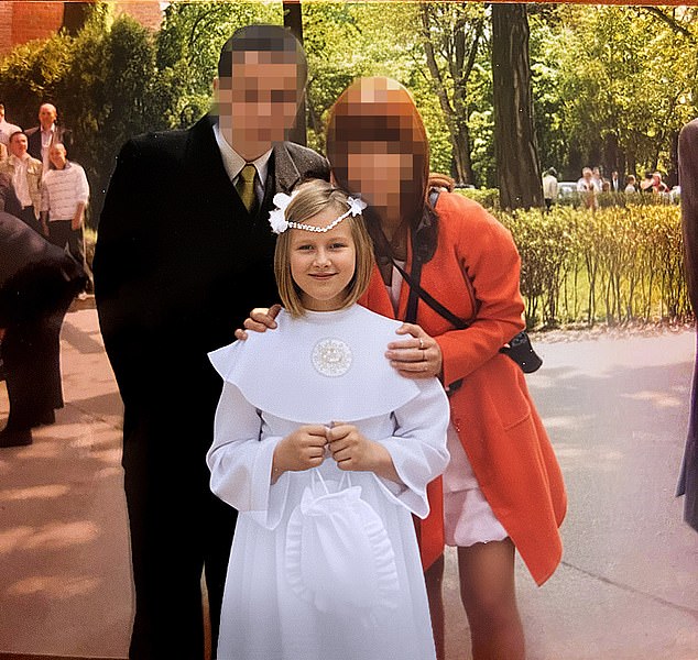 A younger Julia Wandelt with her half-brother and half- sister at her first communion