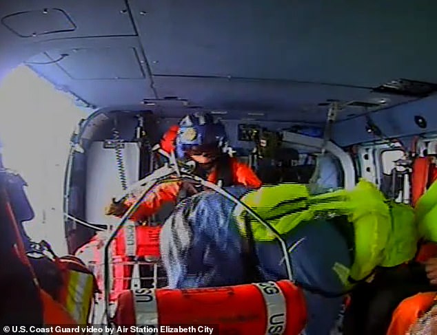 The aircraft refueled after picking up the survivors (pictured) and then returned them safely to Coast Guard Air Station Elizabeth City