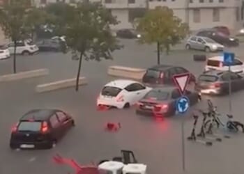 Storm-battered holiday hotspot hit by floods as dramatic vid shows deluge turn streets into rivers and cars submerged