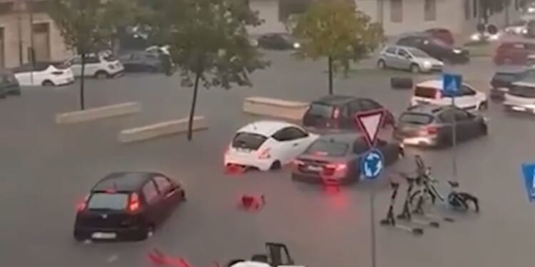Storm-battered holiday hotspot hit by floods as dramatic vid shows deluge turn streets into rivers and cars submerged
